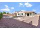 Spacious backyard with a pool, fire pit area, and manicured landscaping at 4360 N 186Th Ln, Goodyear, AZ 85395