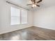 Empty bedroom featuring hardwood floors and natural light at 4360 N 186Th Ln, Goodyear, AZ 85395