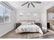 Bright bedroom with multiple windows, light wood floors and neutral décor, creating a welcoming space at 4360 N 186Th Ln, Goodyear, AZ 85395
