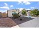 Charming single-Gathering home with desert landscaping, mature trees, and a welcoming curb appeal at 4360 N 186Th Ln, Goodyear, AZ 85395