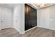 Elegant foyer with dark wood accents and hardwood floors at 4360 N 186Th Ln, Goodyear, AZ 85395