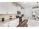 Modern kitchen featuring white cabinets, stainless steel appliances, and granite countertops at 4360 N 186Th Ln, Goodyear, AZ 85395