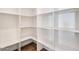 Spacious walk-in pantry with custom shelving providing ample storage space at 4360 N 186Th Ln, Goodyear, AZ 85395