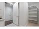 Pantry with open shelving and tiled flooring for organized kitchen storage at 4360 N 186Th Ln, Goodyear, AZ 85395