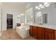 Bright bathroom features double sinks, garden tub, and tile flooring at 4404 W Olney Ave, Laveen, AZ 85339