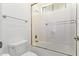 Bright bathroom showcasing a glass-enclosed shower and tub combination at 4404 W Olney Ave, Laveen, AZ 85339
