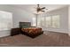 Spacious bedroom with plush carpet, vaulted ceiling, and a large window at 4404 W Olney Ave, Laveen, AZ 85339