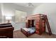 Bedroom with a wooden bunk bed and carpet at 4404 W Olney Ave, Laveen, AZ 85339