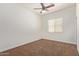 Neutral bedroom offering a ceiling fan and a window with blinds at 4404 W Olney Ave, Laveen, AZ 85339