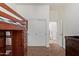 Cozy bedroom featuring a built-in wooden bunk bed and sliding closet doors at 4404 W Olney Ave, Laveen, AZ 85339