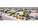 Well-maintained single-Gathering home with a landscaped front yard, mature trees, and a two-car garage at 4404 W Olney Ave, Laveen, AZ 85339