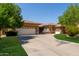 Charming single-story home with a long driveway, three-car garage, and well-maintained landscaping at 4404 W Olney Ave, Laveen, AZ 85339