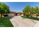 Charming single-story home with a long driveway, three-car garage, and well-maintained landscaping at 4404 W Olney Ave, Laveen, AZ 85339