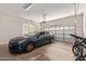 Spacious two-car garage with a car and bicycles parked inside at 4404 W Olney Ave, Laveen, AZ 85339