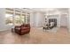 Bright and airy living room featuring a comfortable leather chair and a formal dining area with a chandelier at 4404 W Olney Ave, Laveen, AZ 85339