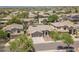 Aerial view of a suburban home showcasing its well-manicured lawn, mature trees, and inviting curb appeal at 4422 E Spur Dr, Cave Creek, AZ 85331