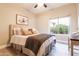 Cozy bedroom with a window view, warm tones, and stylish furnishings at 4422 E Spur Dr, Cave Creek, AZ 85331