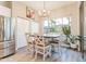 Comfortable dining area with wood table, chairs, and backyard views through a large window creates an inviting meal space at 4422 E Spur Dr, Cave Creek, AZ 85331