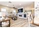 Spacious living room with a decorative fireplace, modern furnishings, and natural light from the windows at 4422 E Spur Dr, Cave Creek, AZ 85331