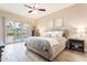 Bright main bedroom features a ceiling fan and direct access to a pool through sliding glass doors at 4422 E Spur Dr, Cave Creek, AZ 85331