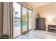 View from the bedroom to the backyard pool with a patio and umbrella at 4422 E Spur Dr, Cave Creek, AZ 85331