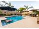 Backyard pool with tanning ledges, waterfalls, lounge areas, and lush landscaping, creating a resort-like atmosphere at 4422 E Spur Dr, Cave Creek, AZ 85331