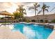 Backyard pool with waterfalls, lounge areas, and lush landscaping, creating a resort-like atmosphere at 4422 E Spur Dr, Cave Creek, AZ 85331