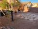 Backyard with desert landscaping, brick accents, and block wall fencing at 4533 E Glenhaven Dr, Phoenix, AZ 85048
