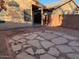 Paver patio surrounded by gravel and block wall in the sunny backyard at 4533 E Glenhaven Dr, Phoenix, AZ 85048