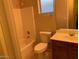 Bathroom featuring a tub, toilet, and single sink vanity at 4533 E Glenhaven Dr, Phoenix, AZ 85048