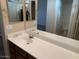 Bathroom vanity with a white countertop, mirror, and sink with vanity at 4533 E Glenhaven Dr, Phoenix, AZ 85048