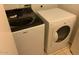 Laundry room featuring a Whirlpool washing machine and a dryer at 4533 E Glenhaven Dr, Phoenix, AZ 85048