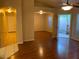 Bright living room with wood floors and views to the backyard, creating a warm and inviting space at 4533 E Glenhaven Dr, Phoenix, AZ 85048