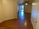 Open living room featuring wood floors and a view of the patio at 4533 E Glenhaven Dr, Phoenix, AZ 85048