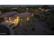 Aerial dusk view of a single-Gathering home and neighborhood, beautifully landscaped with a backyard pool at 4605 E Swilling Rd, Phoenix, AZ 85050