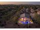 Expansive aerial view showcasing a home with an outdoor pool area in a lush residential neighborhood at 4605 E Swilling Rd, Phoenix, AZ 85050