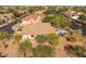 Gorgeous aerial view of a desert community home with a pool, landscaping, and neighboring properties at 4605 E Swilling Rd, Phoenix, AZ 85050