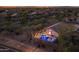 Aerial view of a private backyard featuring a custom pool with fire features and lounge areas at 4605 E Swilling Rd, Phoenix, AZ 85050
