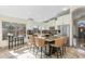 Spacious kitchen with island, stainless appliances, granite counters, and stylish bar seating at 4605 E Swilling Rd, Phoenix, AZ 85050