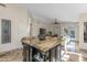 Kitchen with large island, open to the living area, featuring a granite countertop and storage at 4605 E Swilling Rd, Phoenix, AZ 85050