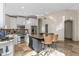 Eat-in kitchen featuring an island, stainless steel appliances and white cabinets for modern living at 4605 E Swilling Rd, Phoenix, AZ 85050