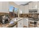 Kitchen with stainless steel appliances, granite countertops, and a large window with natural light at 4605 E Swilling Rd, Phoenix, AZ 85050