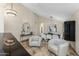 Bright living area with high ceilings, travertine floors, elegant furniture, and stylish décor at 4605 E Swilling Rd, Phoenix, AZ 85050