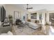 Cozy living room with neutral decor, stylish furnishings, and a ceiling fan for added comfort at 4605 E Swilling Rd, Phoenix, AZ 85050