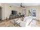Bright and airy living room with sliding glass doors and contemporary furnishings and ceiling fan at 4605 E Swilling Rd, Phoenix, AZ 85050