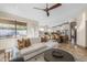 Open floor plan with a living area, kitchen and island seating, perfect for gatherings and everyday living at 4605 E Swilling Rd, Phoenix, AZ 85050
