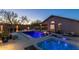 Beautiful backyard with a sparkling pool, hot tub, and inviting outdoor seating areas at 4605 E Swilling Rd, Phoenix, AZ 85050