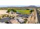 Aerial view featuring a spacious home, nearby parking, and scenic water feature and desert landscape at 5212 S Seton Ct, Gilbert, AZ 85298