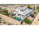 A high angle view shows an estate with a pool and outdoor entertainment area at 5212 S Seton Ct, Gilbert, AZ 85298