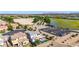 An aerial view of the home showcasing the pool, landscaping, and nearby desert landscape at 5212 S Seton Ct, Gilbert, AZ 85298